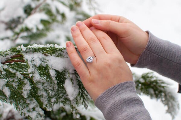 woman hand wearing moissanite ring